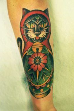 https://rattatattoo.com/wp-content/uploads/2013/09/Karl-Wiman-uses-an-old-school-tattoo-style-to-create-a-nesting-doll-cat-with-American-Traditional-colors-250x373.jpg