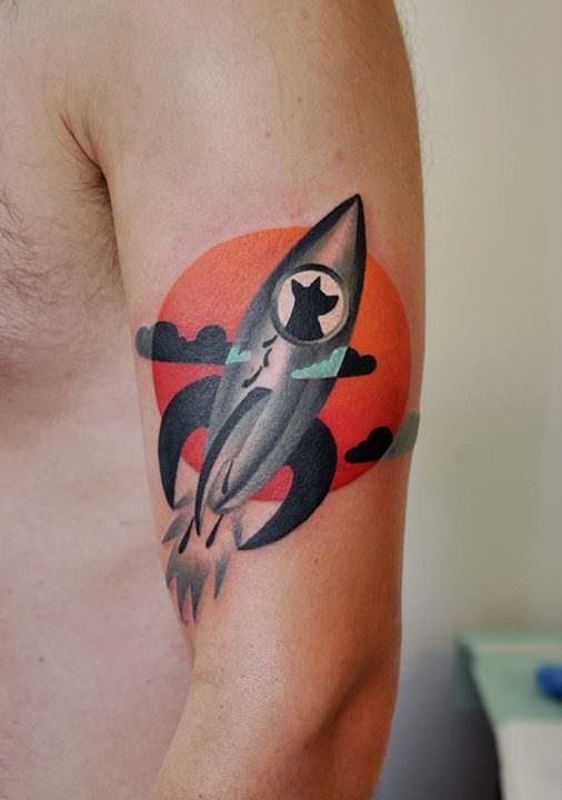 Marcin Surowiec tattoos a dog in a rocket ship flying across the sun in this abstract graphic design tattoo