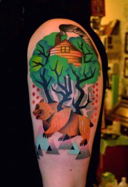 Marcin Surowiec uses cubist shapes and and abstract forms to create this colorful tattoo of a bear in the woods