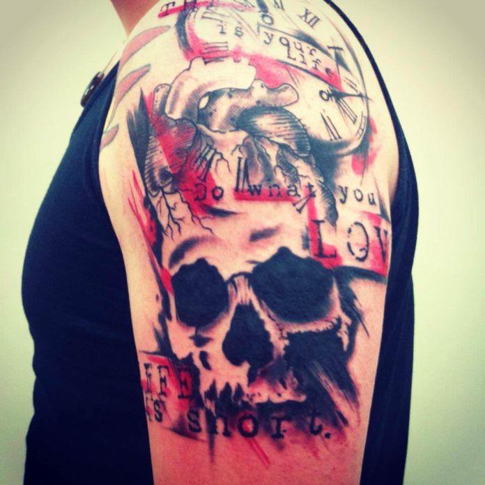 Tattoo artist Mel Wink combines graphics, a human skull, typography and watercolor effects in this artistic tattoo