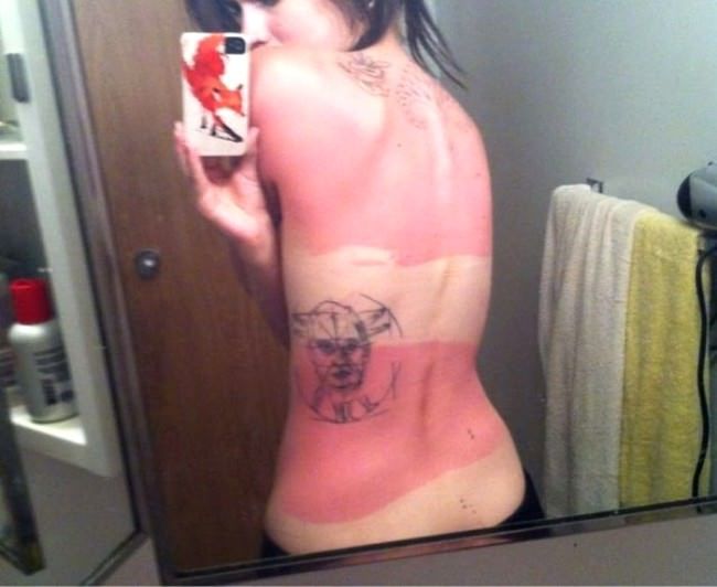 The placement of this tattoo allowed for half of the design to suffer from sunburn