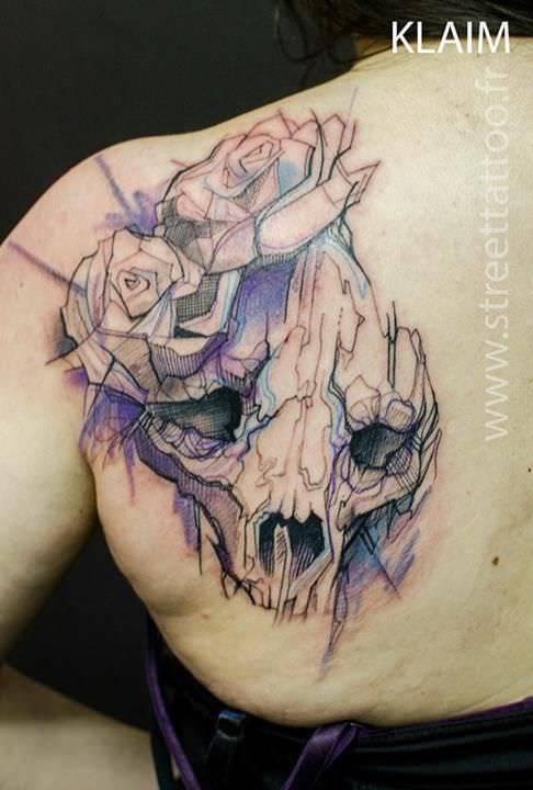KLAIM tattoos an animal skull and roses in an eye catching sketch and watercolor style