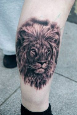A lion comes alive in this photo realistic black and white portrait tattoo by Csiga