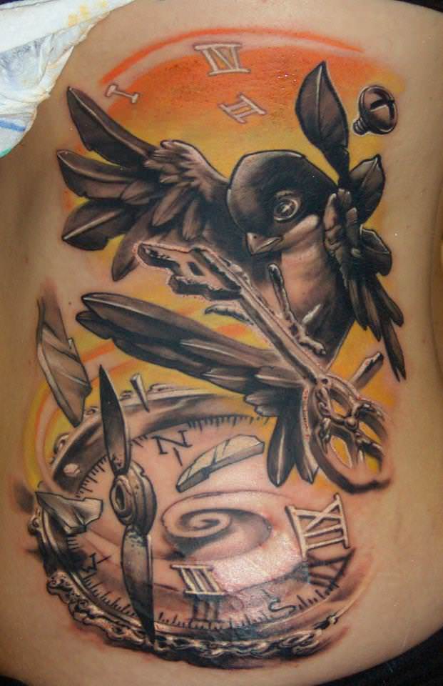A swallow carries a key above a broken compass in this new school tattoo design by Gábor Jelencsik