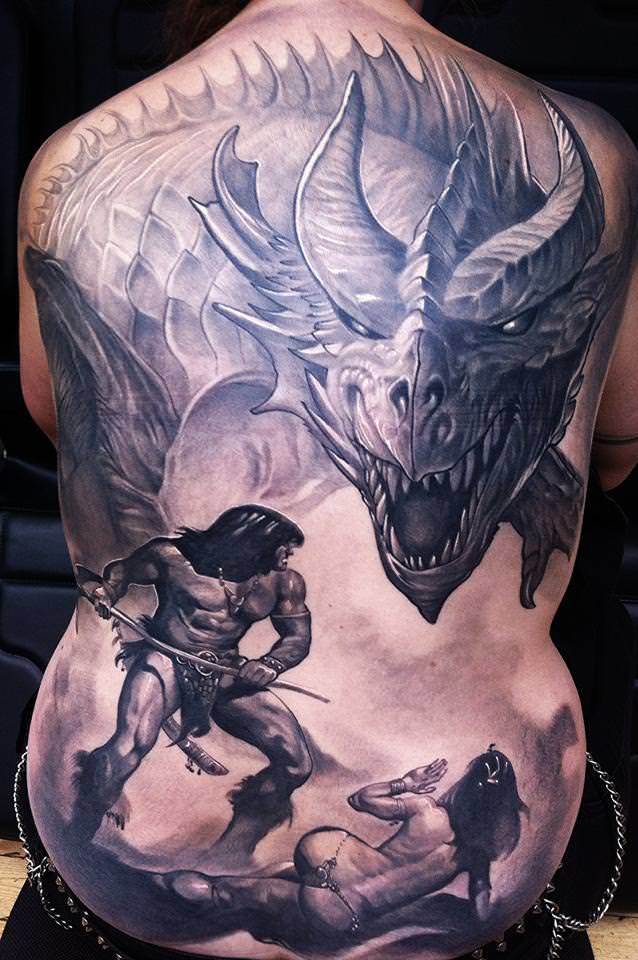 Guil Zekri tattoos an old school superhero in this scene of Conan the Barbarian defending a nude maiden from a dragon