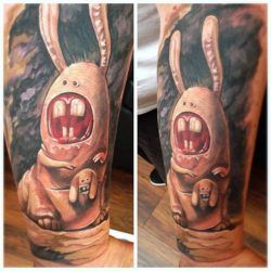 Humorous horror bunnies resemble kangaroos in this unusual surrealist tattoo by Guil Zekri
