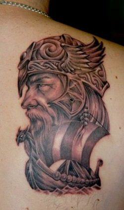 Tattoo artist Csiga creates an ancestry tattoo in this design of a viking with a dragon longboat