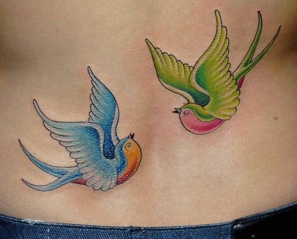 Tattoo artist Csiga proves himself to be a versatile tattoo artist with this American traditional tattoo of two swallows