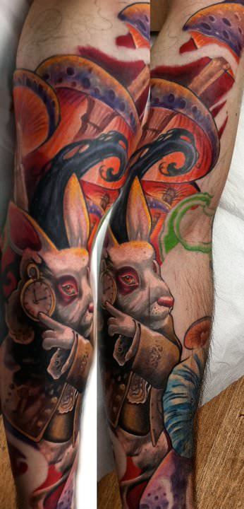 The White Rabbit from Alice in Wonderland is portrayed in vivid color in this fantasy tattoo by Guil Zekri