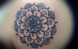 Crisp and clear black ink lines give this spiritual flower of life mandala tattoo design an elegant appeal