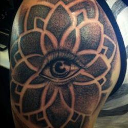 Tattoo artist Dillon Forte has used a human eye at the center of this mandala tattoo to add to the spiritual nature of the design