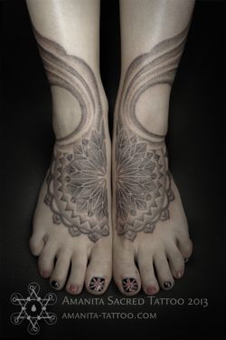 Two separate tattoos by Mike Amanita form one design when this woman puts her feet together