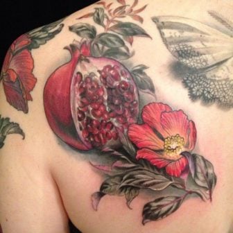 A pomegranate is a powerful symbol of fertility and promise. This beautiful tattoo design comes out of Butterfat Studios.