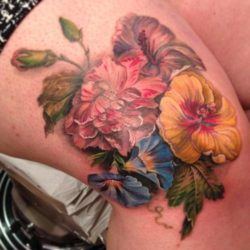 This posy of flowers was taken from a 17th century painting for this lovely, feminine tattoo by BUtterfat studios