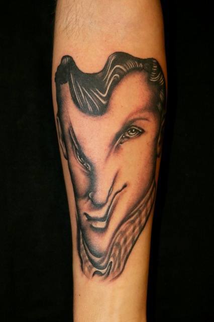 By warping this portrait tattoo, Pietro Sedda creates a character that wouldn't seem out of place in a surrealist world