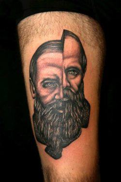 Pietro Sedda gives this portrait tattoo a split personality by seperating the sides of the face