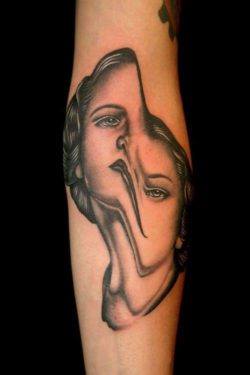 Pietro Sedda gives this portrait tattoo a twisted and psychological edginess by warping the woman's face