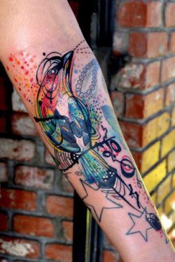This colorful bird tattoo by Petra works a charm to pull together the clients existing tattoos