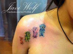 A dog lover celebrates her pets with this artistic watercolor tattoo by Javi Wolf