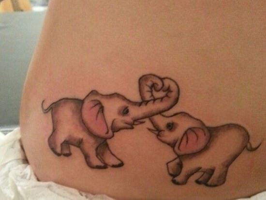 Two baby elephants play in this cute tattoo design, forming a heart with their little baby trunks