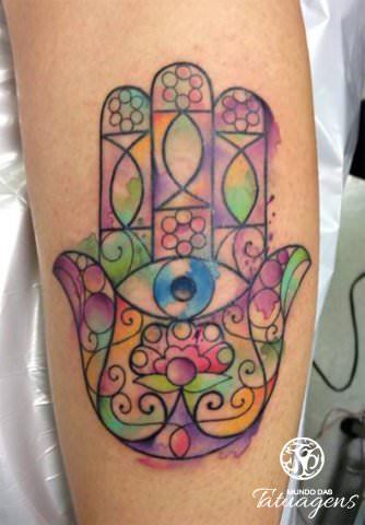 Watercolor paint adds feminine color to this floral Hamsa tattoo design