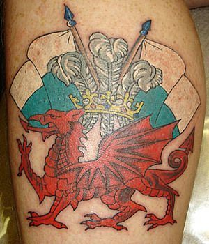 This tattoo of a Welsh dragon with the Welsh flags celebrates patriotism and Welsh royalty
