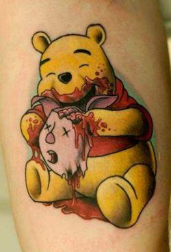 A zombie Pooh Bear eats Piglet's brains in this funny but sick and twisted tattoo by Cavan Infante