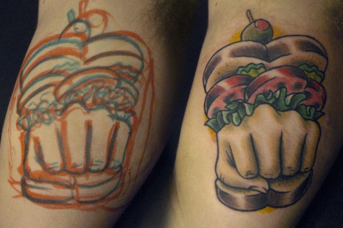 Cavan Infante creates a visual pun in this tattoo of a knuckle sandwhich