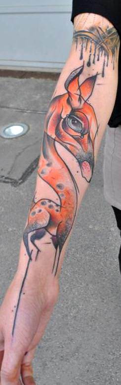 Tattoo artist Mark Halbstark tattoos an unusual giraffe in his unusual artistic style