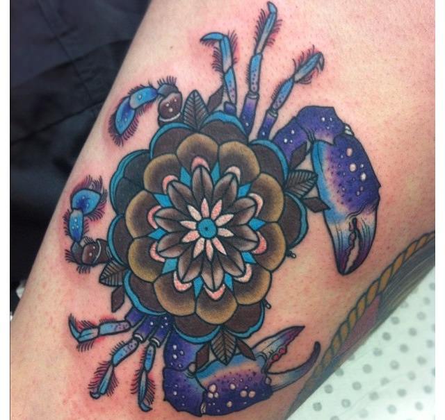 This mandala crab tattoo has an extra meaning as a symbol of the star sign Cancer