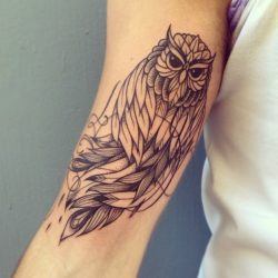 This owl tattoo by Supakitch shows off the artist's stunning linework