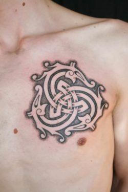 Three serpents chase one another in an eternal cycle in this celtic tattoo by Art on the Body tattoo studio