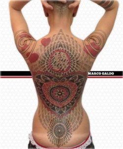 A heart shaped mandala is the center of this sacred geometry tattoo by Marco Galdo