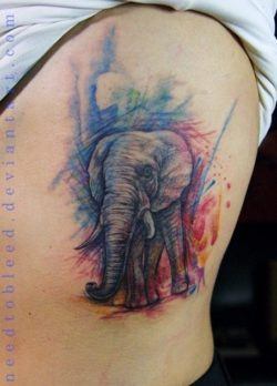Benjamin Otero has used a sketchy watercolor style to create this colorful elephant tattoo.
