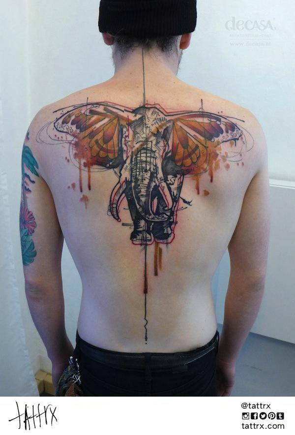 Carola Deutsch uses a watercolor tattoo style to create this fantasy tattoo of an elephant with butterfly wings as ears