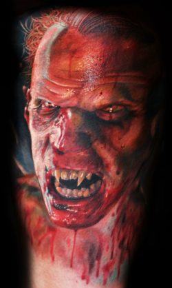 Mario Hartmann inks a horrifyingly realistic tattoo of a vampire dripping with blood