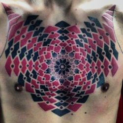 Tattoo artist Marco Galdo uses black and red ink to create this chest tattoo of a mandala flower surrounded by geometric shapes