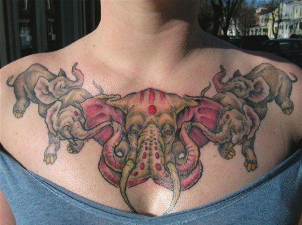 Tattoos artist Michael Moses creates a surreal fantasy tattoo of four elephants frolicking around a double trunked elephant god