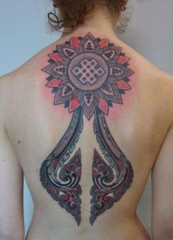 This large back tattoo by Marco Galdo is a fusion of paisley patterns and geometric mandalas