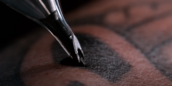 This pronged tattoo needle contains two needle that allow the tattoo artist to create a double-weight line