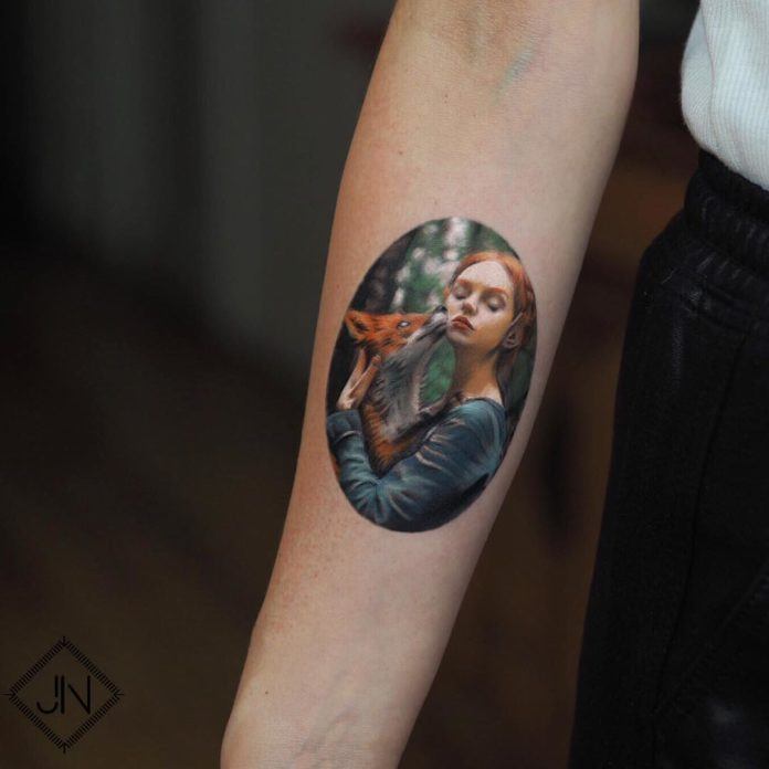 A beautiful elf girl cuddles with her pet fox in this full color photo realistic tattoo by Jefree Naderali