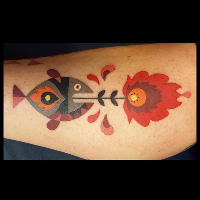 A fish burps up a fiery flower in this humorous geometric tattoo by Amanda Chamfreau