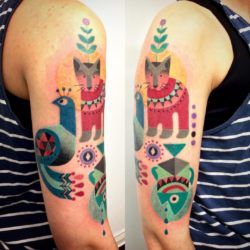 Creatures from the orient, including a peacock, feature in this geometric and colorful tattoo by Amanda Chamfreau