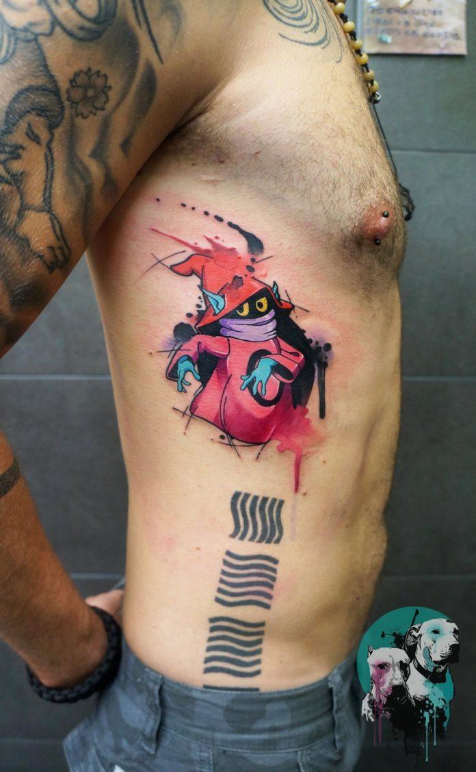 Dynoz tattoos Orko from the He-Man series, packing this little rib design with loads of personality and color.
