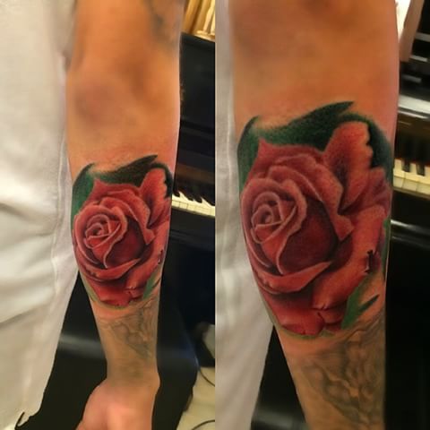 Jefree Naderali shows off his skill with color ink in this photo realistic red rose tattoo.