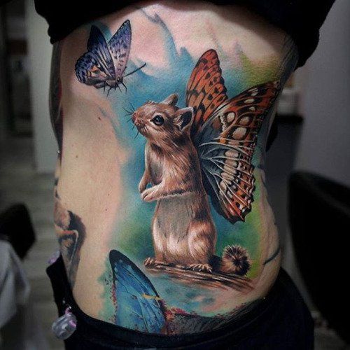 Sandra Daukshta creates a whimsical fantasy tattoo by giving this squirrel a pair of colourful butterfly wings