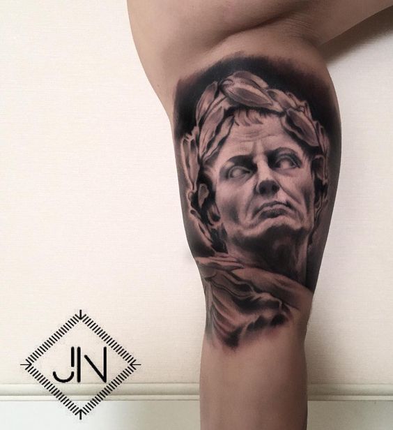 Tattoo artist Jefree Naderali created a photo realistic portrait tattoo of a sculpture of Julius Caesar