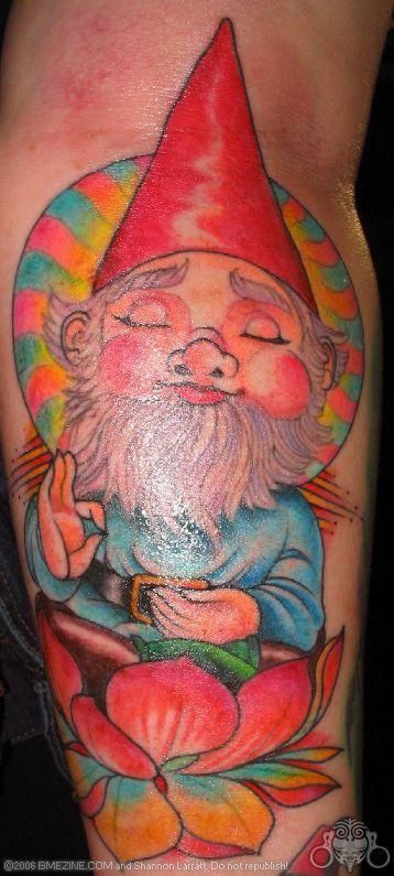 A very zen gnome meditates while sitting in a lotus flower in this colorful tattoo