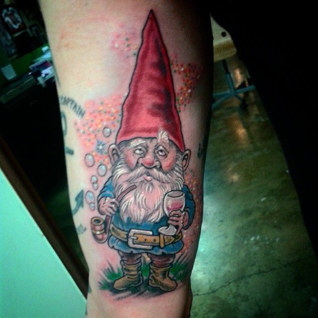 An intoxicated gnome is featured in this funny tattoo