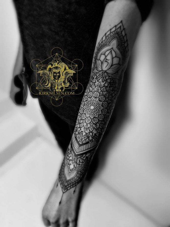 Kirk Nilsen's black ink tattoos often feature a distinctly Buddhist influence, as can be seen in the lotus flower in this tattoo design